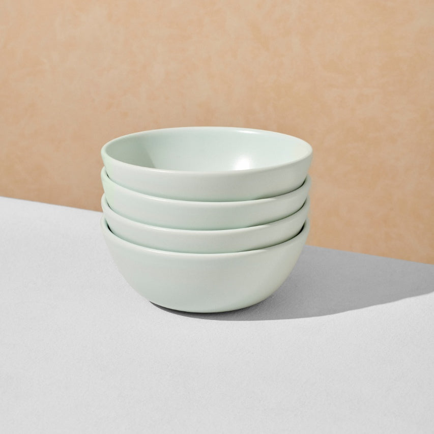 Stack of four mint breakfast bowls