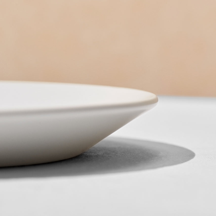 Close up of angled rim of dinner plate