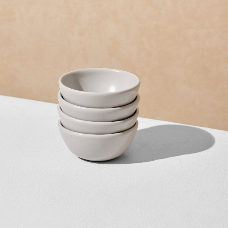 Stack of four grey mini bowls