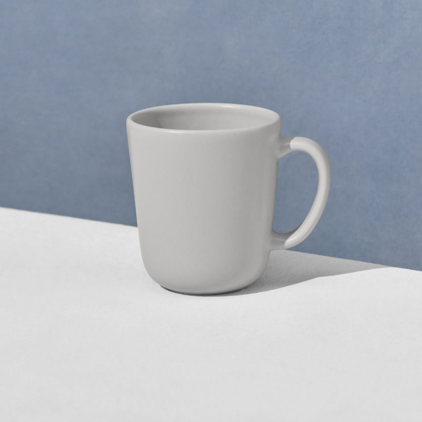 Angled view of single grey mug
