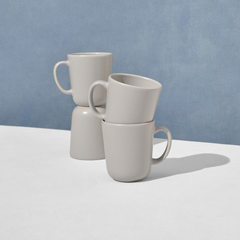 Grouping of four grey mugs