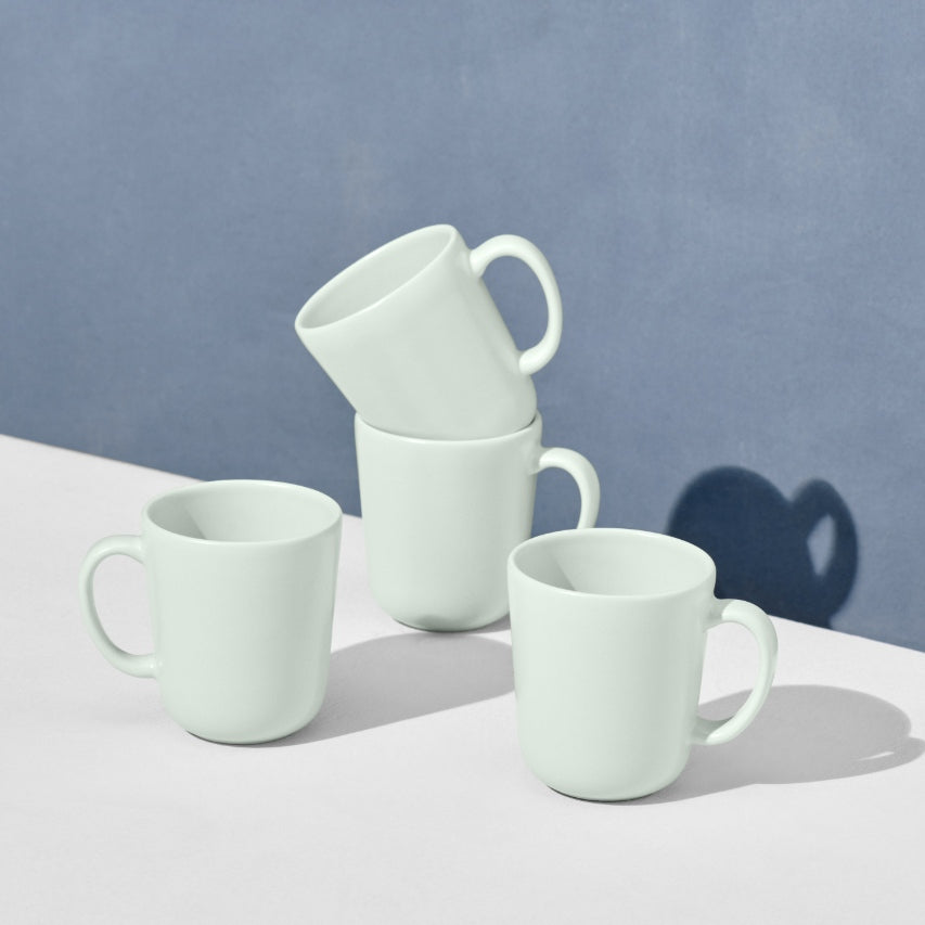 Grouping of four mint mugs