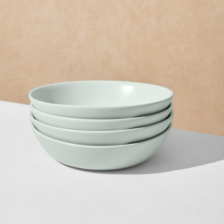 Stack of four mint pasta bowls