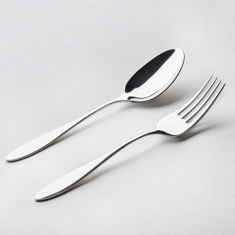 Angled view of classic stainless steel flatware serving set