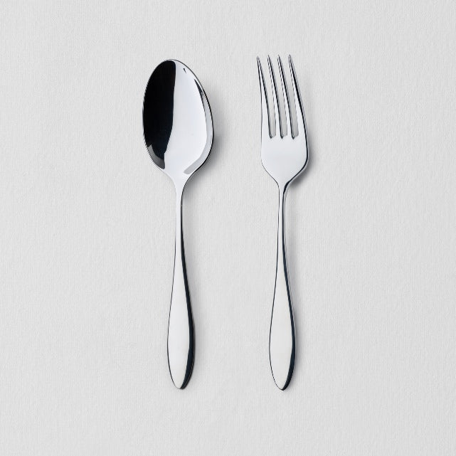 Overhead view of classic stainless steel flatware serving set