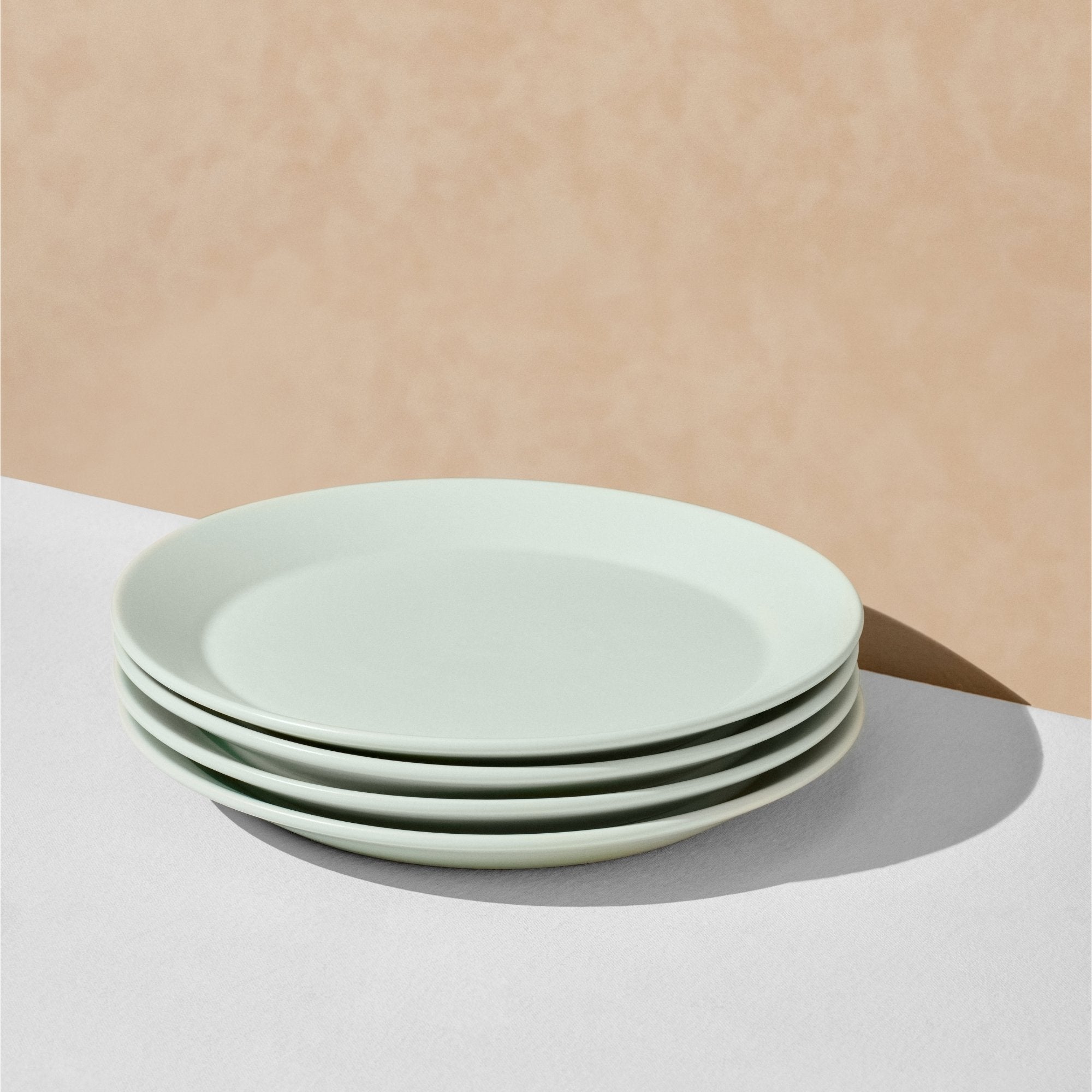 Stack of four mint dinner plates