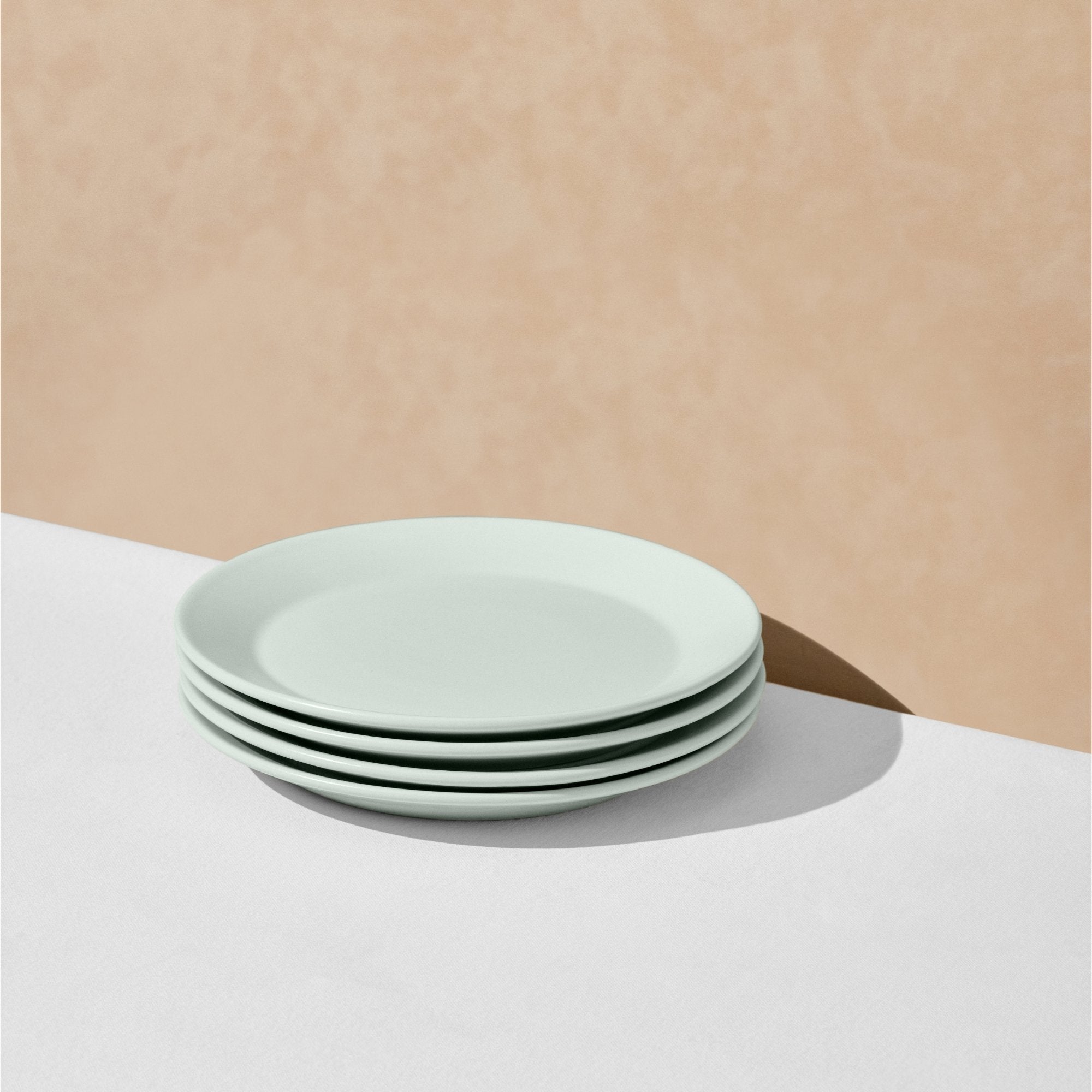Stack of four mint salad plates